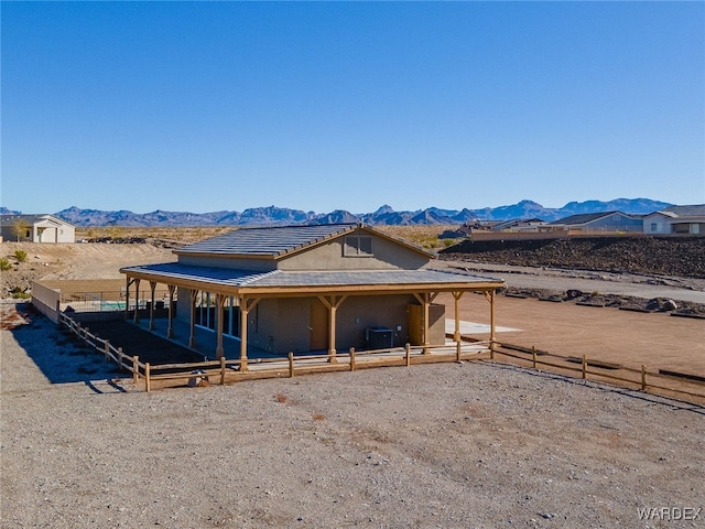 exterior space featuring an enclosed area and a mountain view