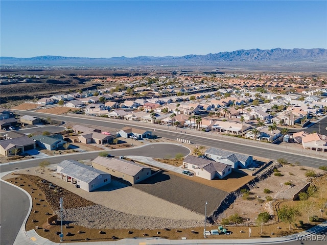 drone / aerial view featuring a residential view and a mountain view