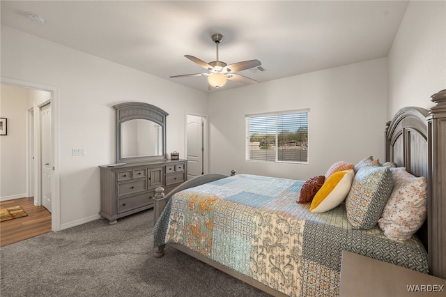 carpeted bedroom featuring ceiling fan and baseboards