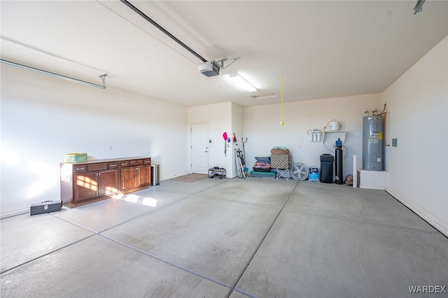 garage featuring water heater and a garage door opener