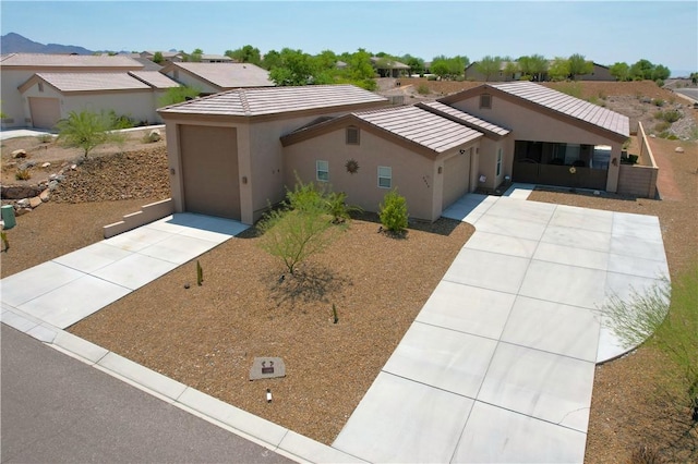 2600 Slide Mountain Loop, Bullhead City, AZ 86442 - single story home featuring concrete driveway, a garage, and stucco siding