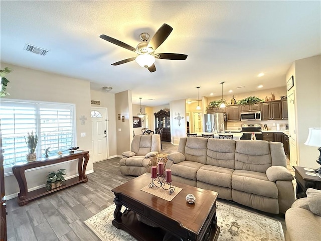 2600 Slide Mountain Loop, Bullhead City, AZ 86442 - living area featuring a ceiling fan, wood finished floors, and recessed lighting