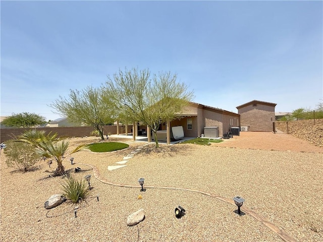 2600 Slide Mountain Loop, Bullhead City, AZ 86442 - view of front of property with a patio, a fenced backyard, and stucco siding