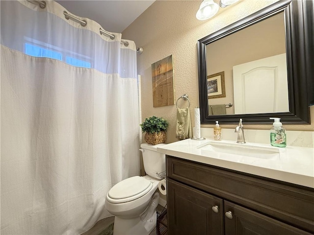 2600 Slide Mountain Loop, Bullhead City, AZ 86442 - full bath featuring a textured wall, vanity, and curtained shower