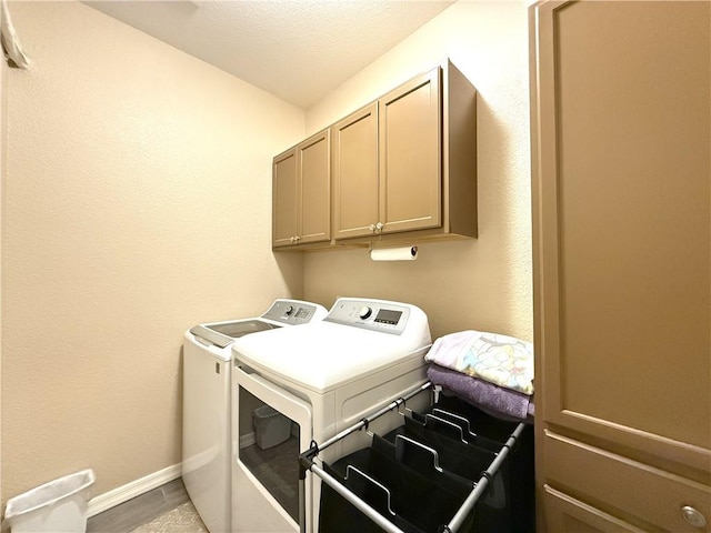 2600 Slide Mountain Loop, Bullhead City, AZ 86442 - washroom with washing machine and dryer, cabinet space, and a textured ceiling