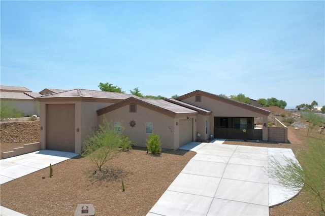 2600 Slide Mountain Loop, Bullhead City, AZ 86442 - single story home with driveway, a garage, and stucco siding