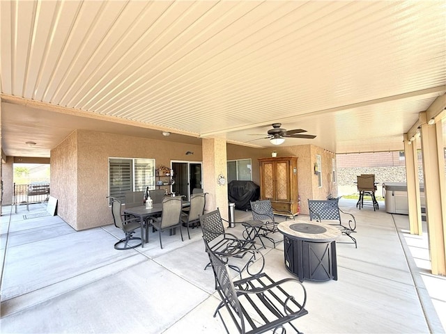 2600 Slide Mountain Loop, Bullhead City, AZ 86442 - view of patio featuring a fire pit, ceiling fan, and outdoor dining area