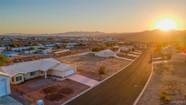 aerial view at dusk with a residential view and a mountain view