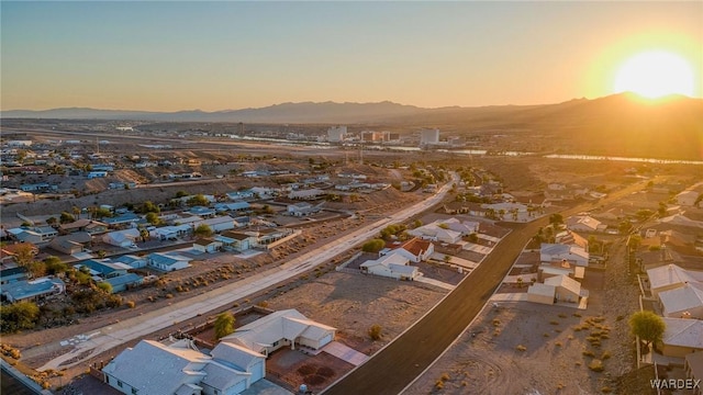 aerial view at dusk with a residential view and a mountain view