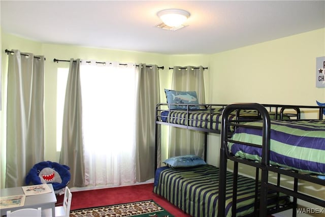 carpeted bedroom with visible vents