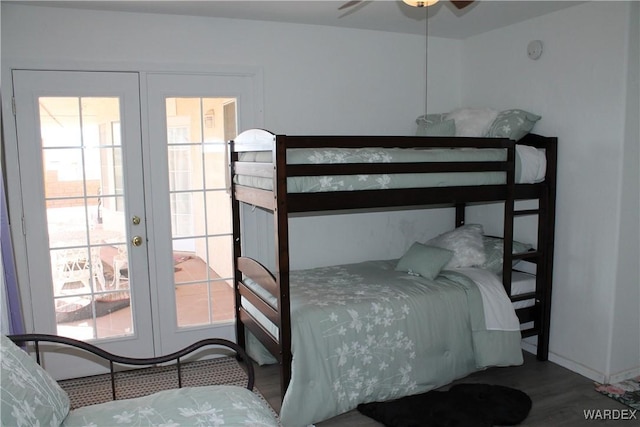 bedroom featuring french doors and wood finished floors