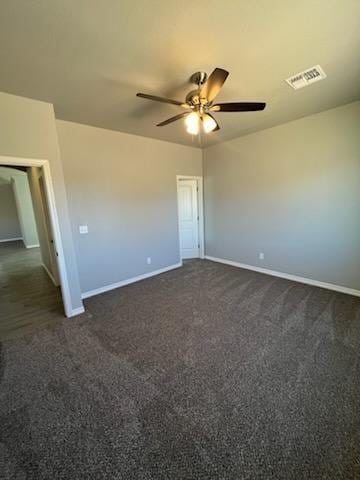 3515 E Lum Ave, Kingman, AZ 86409 - unfurnished room featuring ceiling fan, baseboards, and dark colored carpet