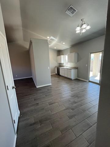 3515 E Lum Ave, Kingman, AZ 86409 - unfurnished living room with baseboards, a chandelier, and recessed lighting