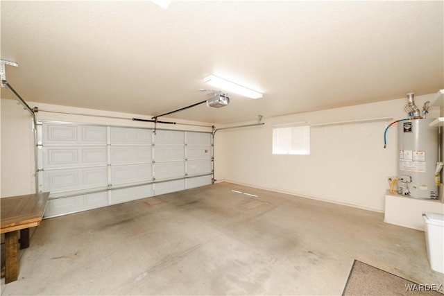 garage featuring gas water heater and a garage door opener