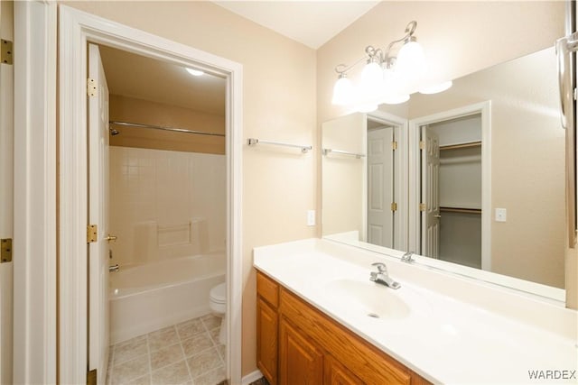 full bath with vanity, tile patterned floors, toilet, and bathtub / shower combination