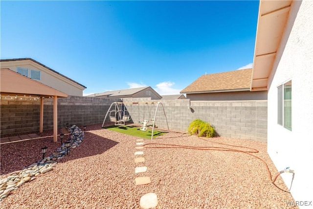 view of yard with a fenced backyard