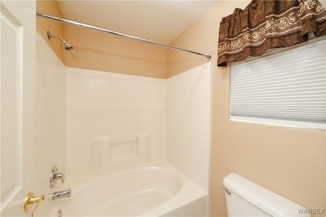 bathroom featuring toilet and shower / bathtub combination