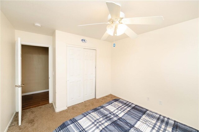 3048 Mallory Loop, Kingman, AZ 86401 - unfurnished bedroom featuring carpet flooring, a closet, baseboards, and ceiling fan