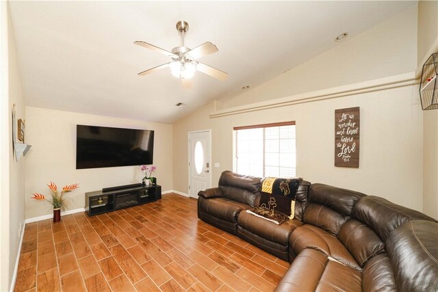 3048 Mallory Loop, Kingman, AZ 86401 - living area with vaulted ceiling, ceiling fan, and baseboards