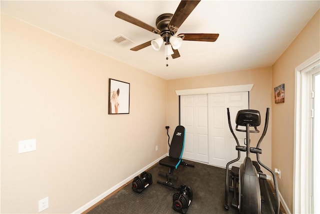 3048 Mallory Loop, Kingman, AZ 86401 - exercise room with a ceiling fan, baseboards, and dark colored carpet