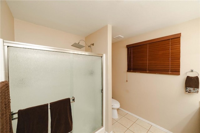 3048 Mallory Loop, Kingman, AZ 86401 - full bath with a stall shower, toilet, tile patterned flooring, and baseboards