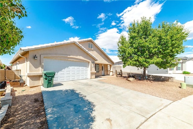 3048 Mallory Loop, Kingman, AZ 86401 - ranch-style home featuring stucco siding, concrete driveway, and an attached garage