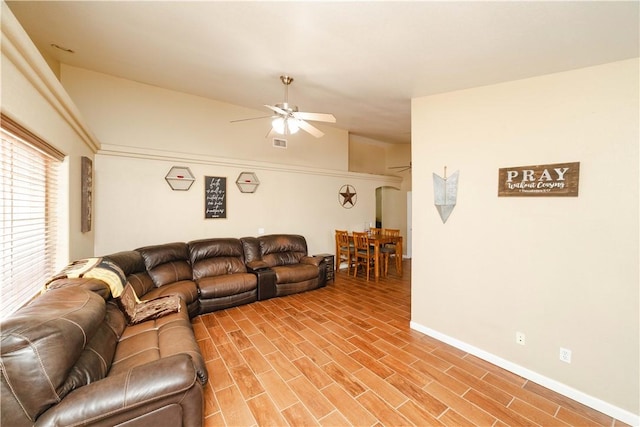 3048 Mallory Loop, Kingman, AZ 86401 - living room with a ceiling fan, baseboards, and light wood-style flooring