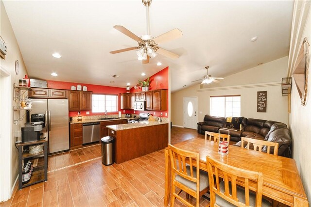 3048 Mallory Loop, Kingman, AZ 86401 - dining area with a ceiling fan, vaulted ceiling, recessed lighting, and light wood-style flooring