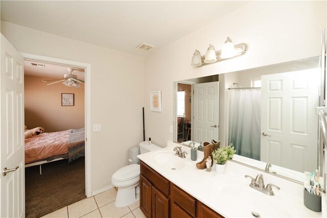 3048 Mallory Loop, Kingman, AZ 86401 - full bathroom with ensuite bath, tile patterned floors, double vanity, and toilet