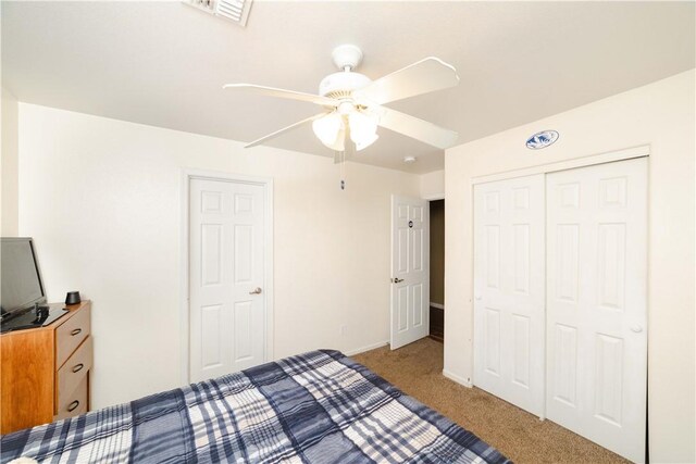 3048 Mallory Loop, Kingman, AZ 86401 - unfurnished bedroom featuring carpet flooring, a closet, baseboards, and ceiling fan