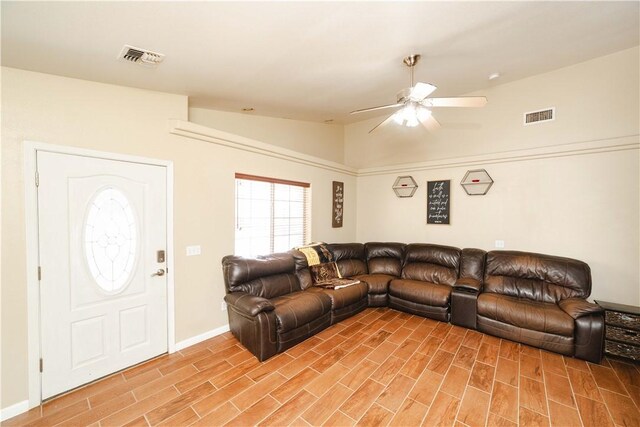 3048 Mallory Loop, Kingman, AZ 86401 - living room featuring a ceiling fan, lofted ceiling, light wood finished floors, and baseboards