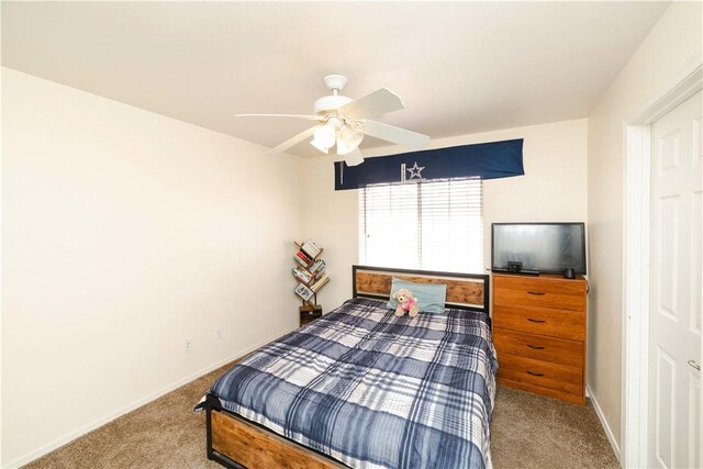 3048 Mallory Loop, Kingman, AZ 86401 - carpeted bedroom with baseboards and a ceiling fan