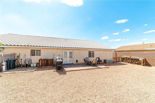 3048 Mallory Loop, Kingman, AZ 86401 - rear view of property featuring french doors, a fenced backyard, a patio, and stucco siding