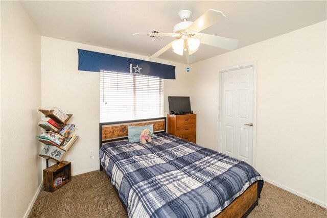 3048 Mallory Loop, Kingman, AZ 86401 - bedroom with carpet, baseboards, and a ceiling fan