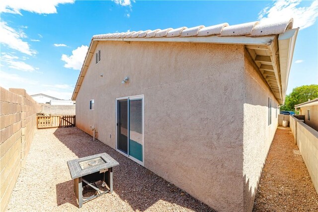 3048 Mallory Loop, Kingman, AZ 86401 - back of property with stucco siding and a fenced backyard