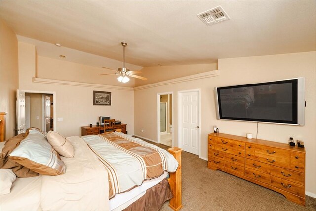 3048 Mallory Loop, Kingman, AZ 86401 - bedroom featuring lofted ceiling, light colored carpet, ensuite bath, baseboards, and a ceiling fan