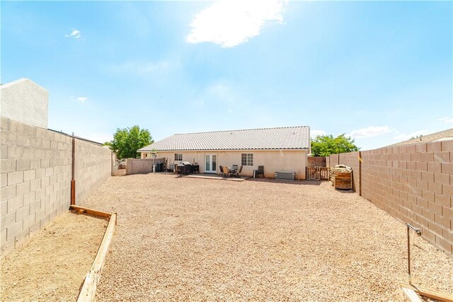 3048 Mallory Loop, Kingman, AZ 86401 - rear view of property with a fenced backyard, a patio, and stucco siding