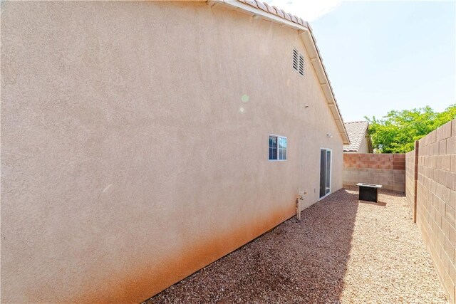3048 Mallory Loop, Kingman, AZ 86401 - view of home's exterior with stucco siding and a fenced backyard