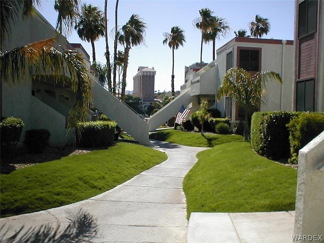 view of home's community with a yard