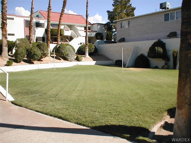 view of yard featuring cooling unit and a residential view