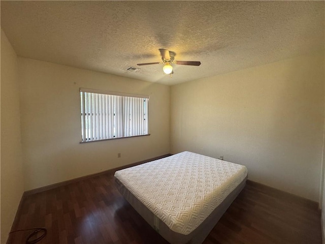 2024 E Mountain View Pl, Fort Mohave, AZ 86426 - bedroom featuring wood finished floors, a textured ceiling, and ceiling fan