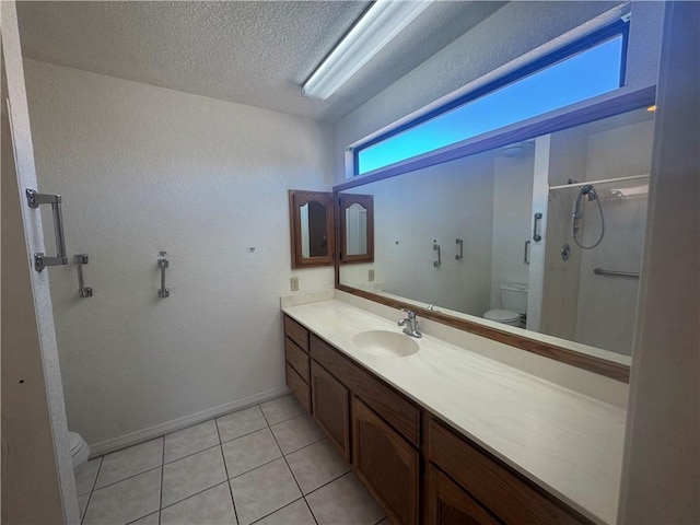 2024 E Mountain View Pl, Fort Mohave, AZ 86426 - full bathroom with toilet, a stall shower, vanity, a textured ceiling, and tile patterned floors