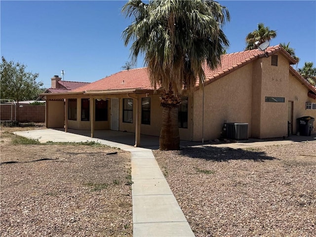 2024 E Mountain View Pl, Fort Mohave, AZ 86426 - back of house featuring central AC, a patio area, stucco siding, and a tiled roof