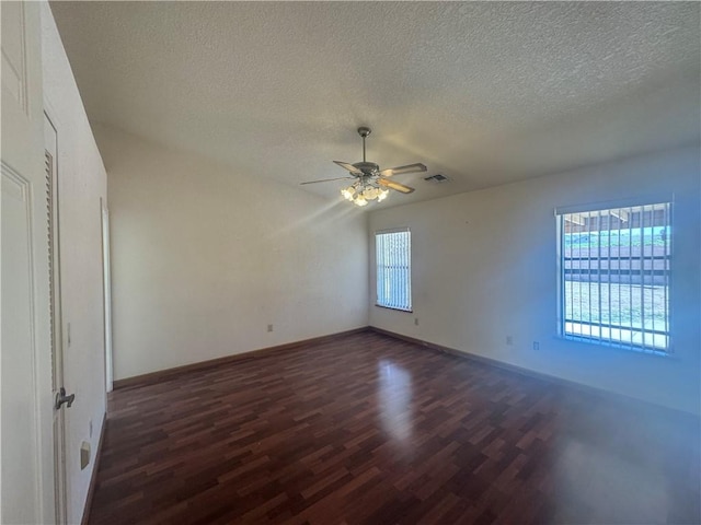 2024 E Mountain View Pl, Fort Mohave, AZ 86426 - empty room featuring dark wood-type flooring, a textured ceiling, ceiling fan, and baseboards