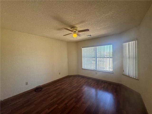2024 E Mountain View Pl, Fort Mohave, AZ 86426 - spare room with dark wood-style floors, ceiling fan, a textured ceiling, and baseboards