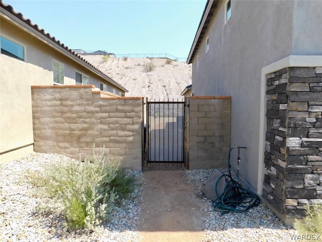 view of gate featuring fence