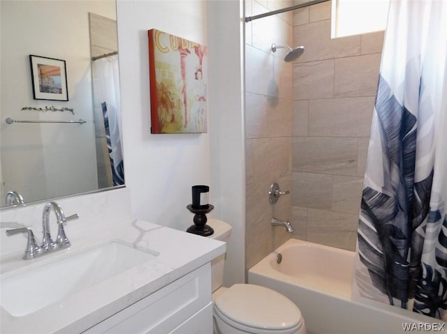 full bathroom with toilet, shower / tub combo, and vanity