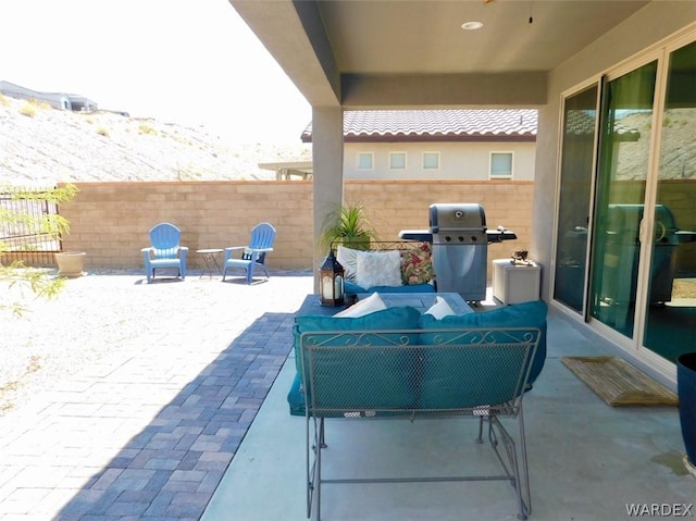 view of patio with a fenced backyard, grilling area, and an outdoor hangout area