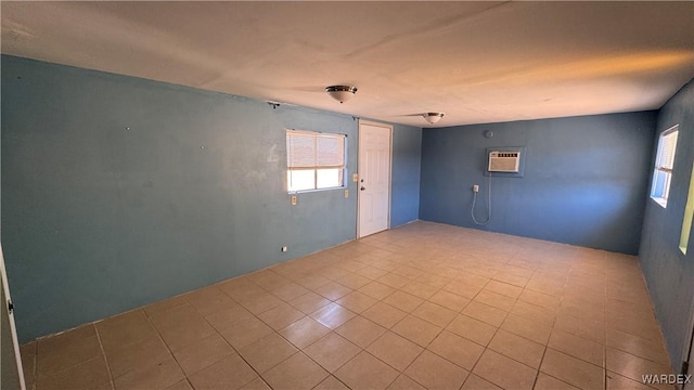 unfurnished room with a wall mounted air conditioner