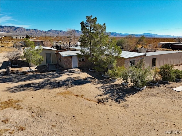 rear view of property featuring a mountain view